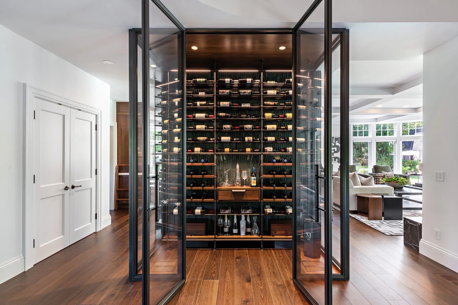 The glass wine room is a temperature controlled work of art.