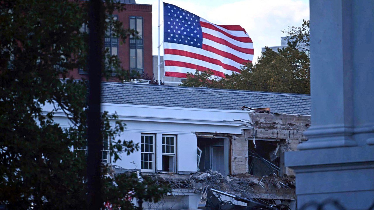 East Wing of the White House partly demolished with the American flag