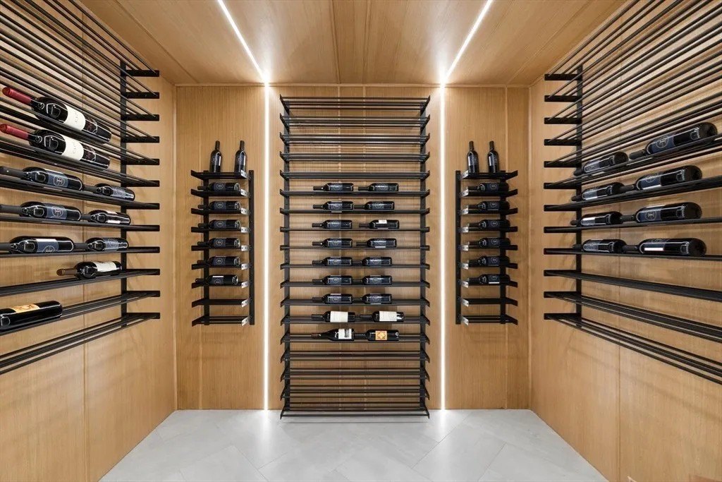NBA Star Jrue Holiday Lists His Massachusetts Home For $6.9 Million—Weeks After Portland Trail Blazers Wine room in a luxury home in Massachusetts that belongs to Jrue Holiday