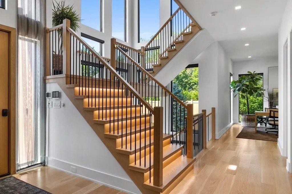 NBA Star Jrue Holiday Lists His Massachusetts Home For $6.9 Million—Weeks After Portland Trail Blazers Stairs with lighting in a luxury home in Massachusetts that belongs to Jrue Holiday